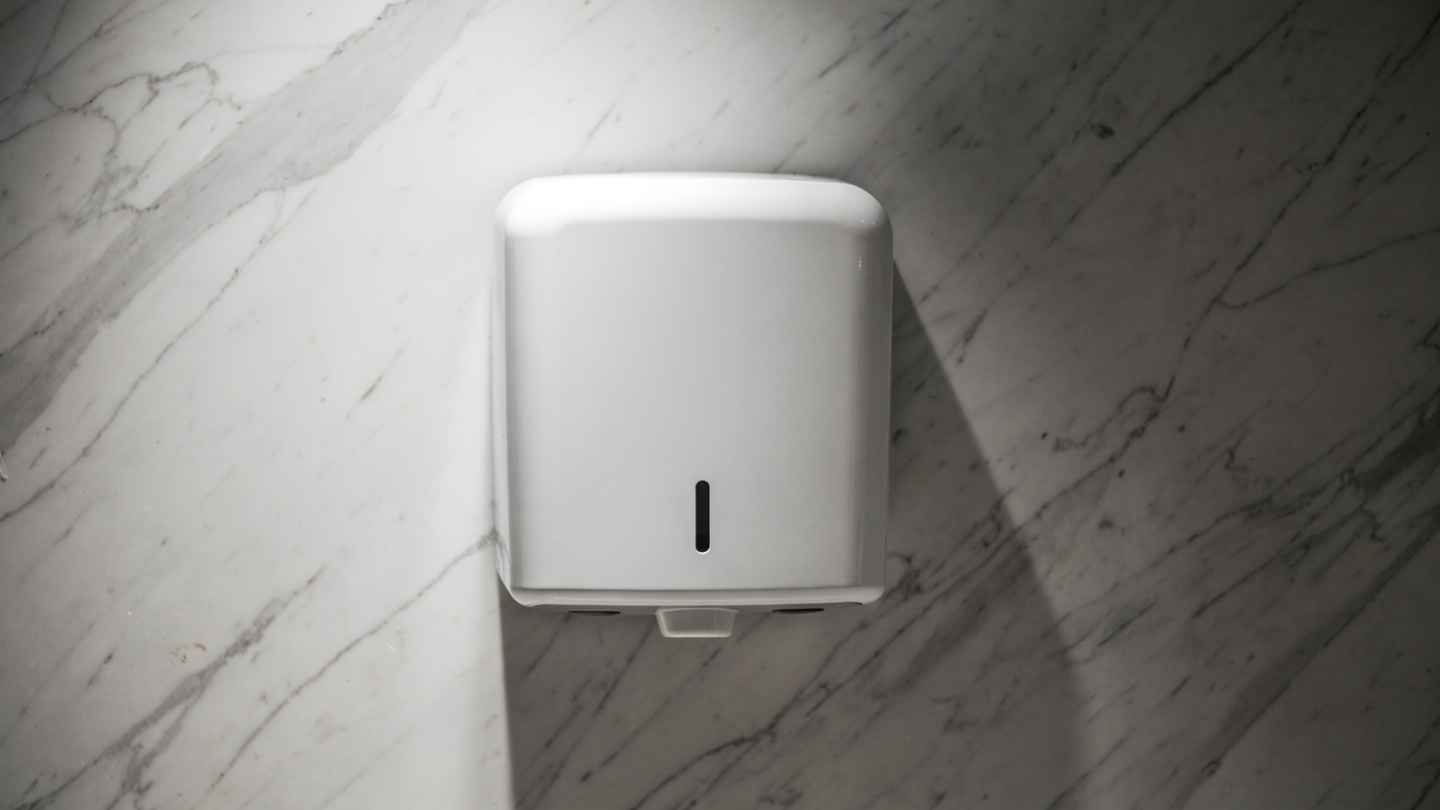 automatic sensor hand dryer in cafe bathroom